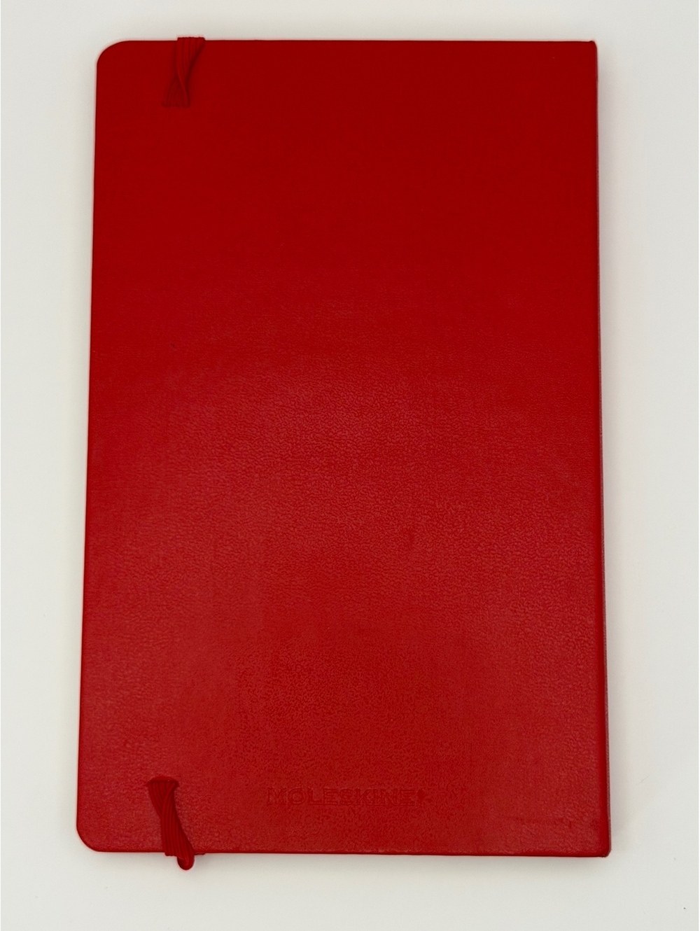 Moleskine red lined notebook